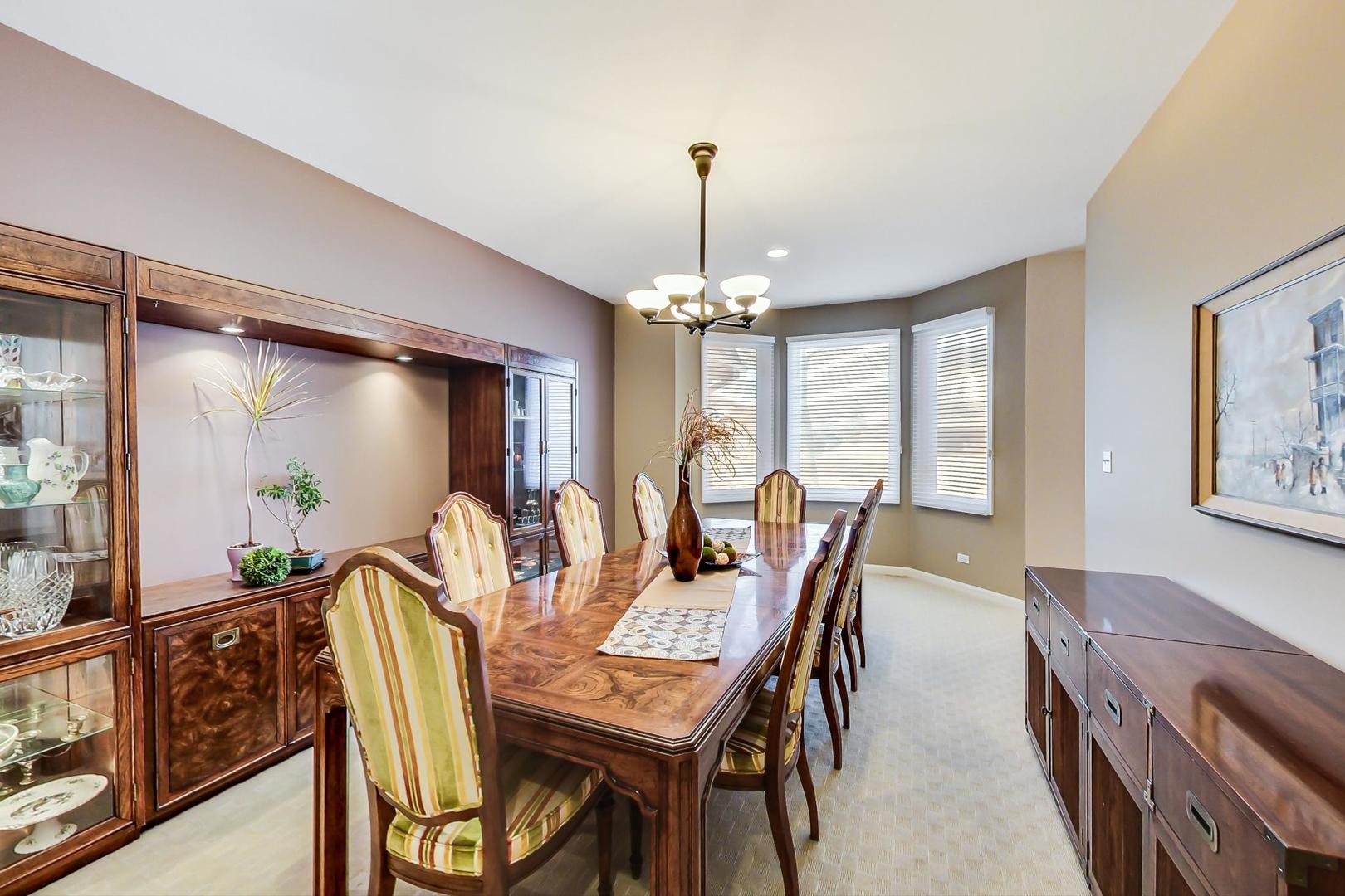 1927 Sheridan Road Buffalo Grove, IL 60089 - Photo 4 of 29 a view of a dining room with furniture window and outside view
