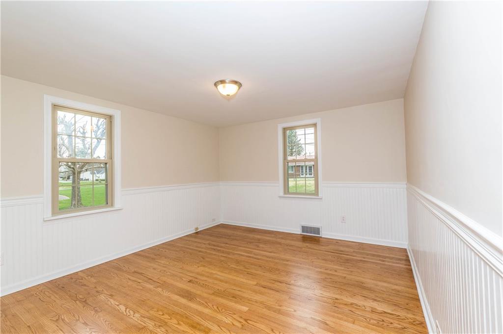 500 Friel Road Baden, PA 15005 - Photo 13 of 24 Retreat to this peaceful, massive first floor master suite, complete with hardwood floors, white wainscoting, new ceiling light, windows, walk-in closet, and full master bath. Gorgeous!