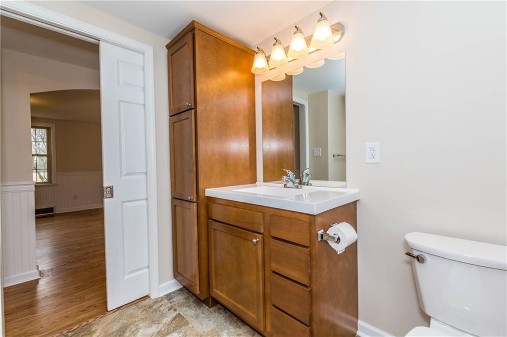 500 Friel Road Baden, PA 15005 - Photo 15 of 24 Spacious, private master bath, accessible from the master bedroom, via a pocket door. NEW everything, including tons of cabinets/storage, new sink and faucet, mirror and lights, commode, tub and shower.
