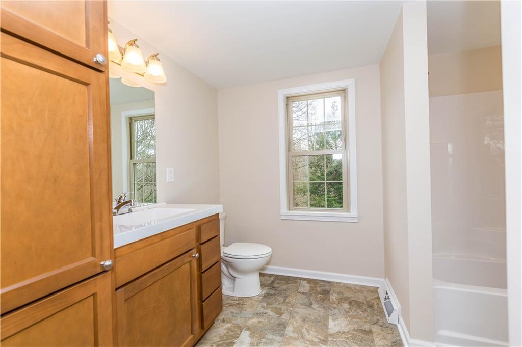 500 Friel Road Baden, PA 15005 - Photo 16 of 24 Spacious, private master bath, accessible from the master bedroom, via a pocket door. NEW everything, including tons of cabinets/storage, new sink and faucet, mirror and lights, commode, tub and shower.