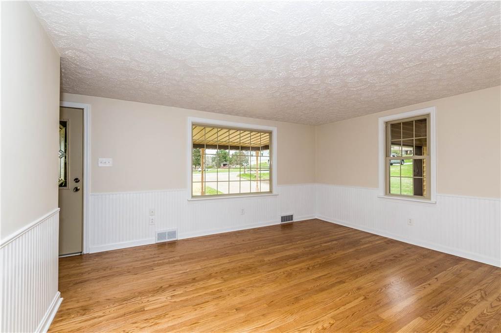 500 Friel Road Baden, PA 15005 - Photo 3 of 24 Enter through the front door to a completely renovated living room/family room with hardwood floors, windows, and white wainscoting.