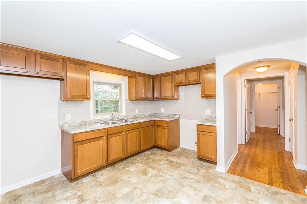 500 Friel Road Baden, PA 15005 - Photo 5 of 24 The heart of the home is this completely renovated, huge kitchen! New everything: cabinets, counters, stainless sink and faucet, backsplash, vinyl flooring, and lights. Perfect for entertaining friends and family, or simply enjoying meal time with family.