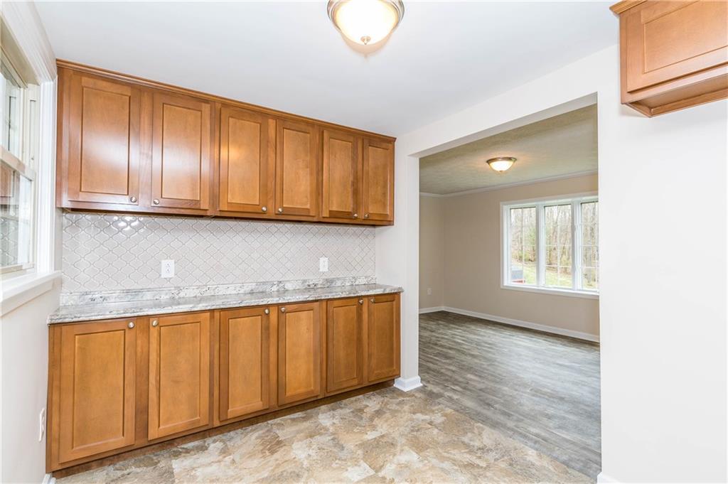 500 Friel Road Baden, PA 15005 - Photo 7 of 24 Wall-to-wall counter space and loads of cabinets for storage. Wow! Kitchen leads to the dining room with large bay window with panoramic views of the land.