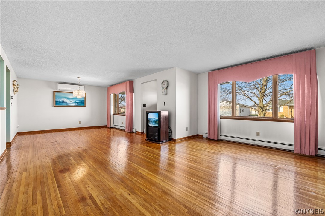 39 Cardy Lane Cheektowaga, NY 14043 - Photo 4 of 32 Beautiful hardwood floors living room/dining room