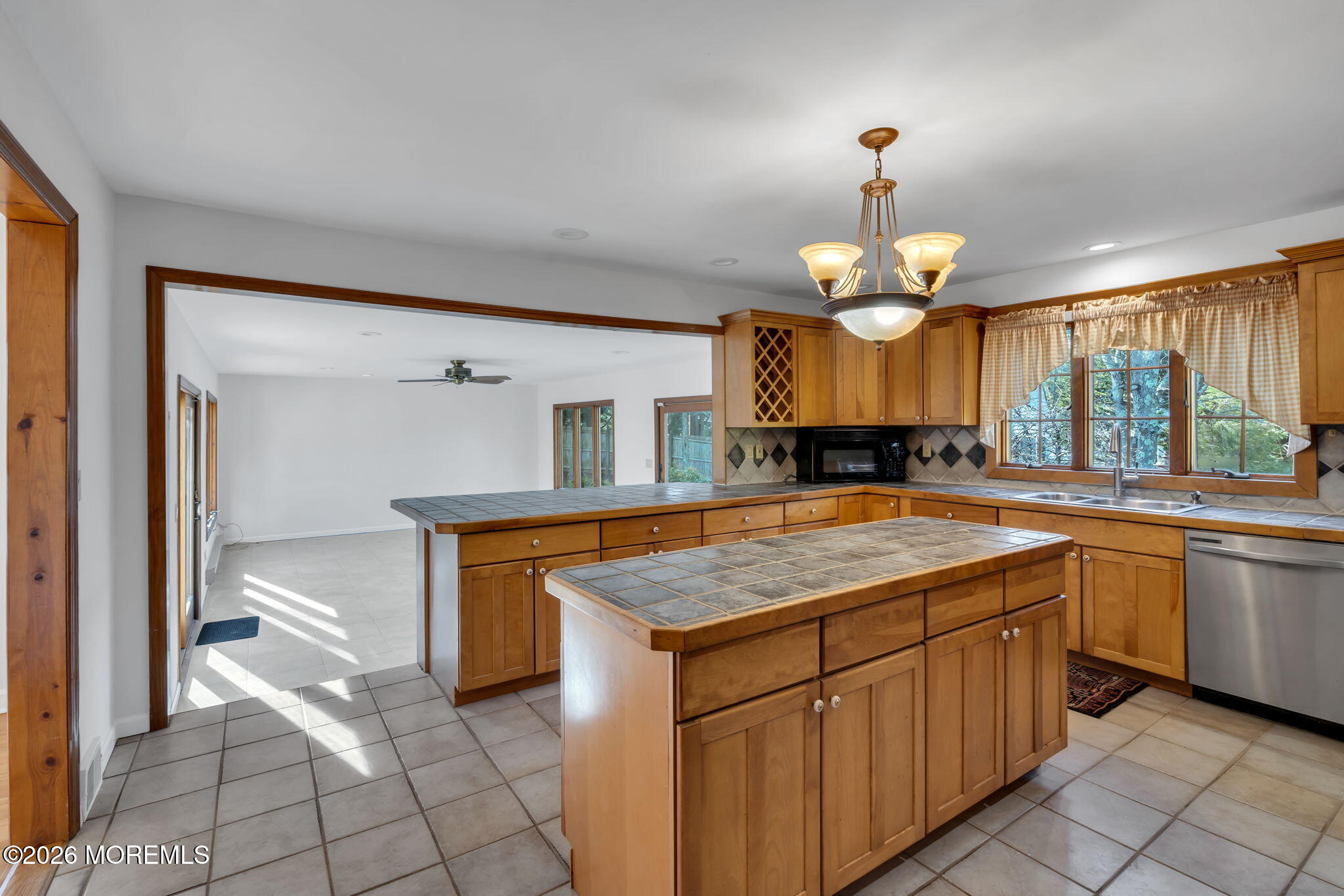 53 Montrose Road Colts Neck, NJ 07722 - Photo 14 of 43 a kitchen with a sink and chandelier