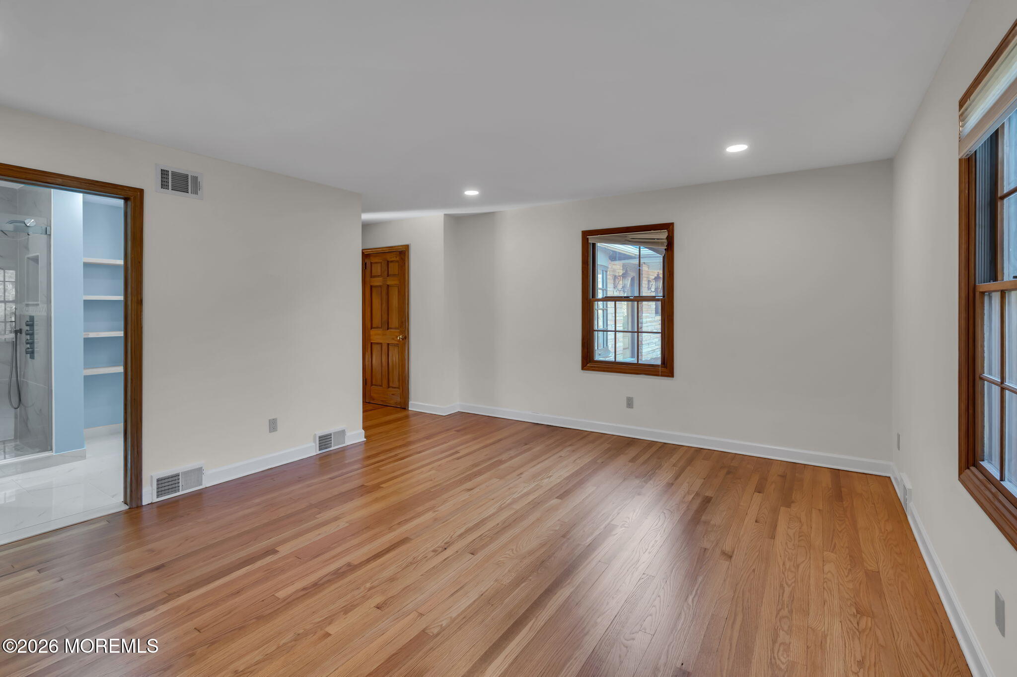 53 Montrose Road Colts Neck, NJ 07722 - Photo 18 of 43 an empty room with wooden floor and windows