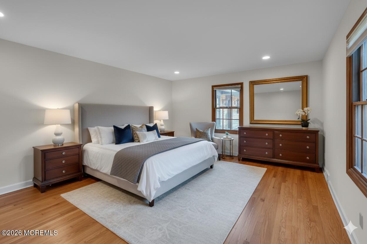 53 Montrose Road Colts Neck, NJ 07722 - Photo 19 of 43 a spacious bedroom with a bed and a dresser
