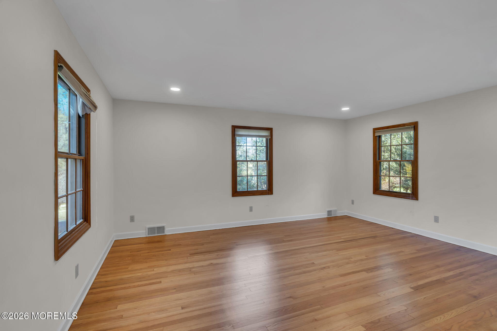 53 Montrose Road Colts Neck, NJ 07722 - Photo 24 of 43 a view of an empty room with wooden floor and a window