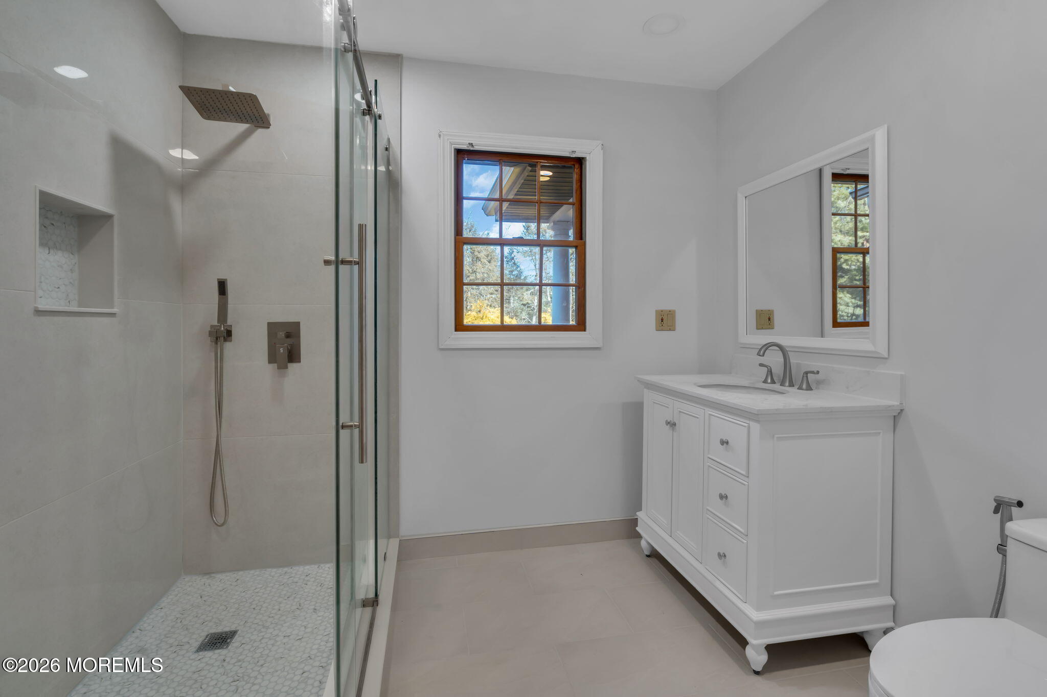 53 Montrose Road Colts Neck, NJ 07722 - Photo 26 of 43 a bathroom with a shower sink and mirror