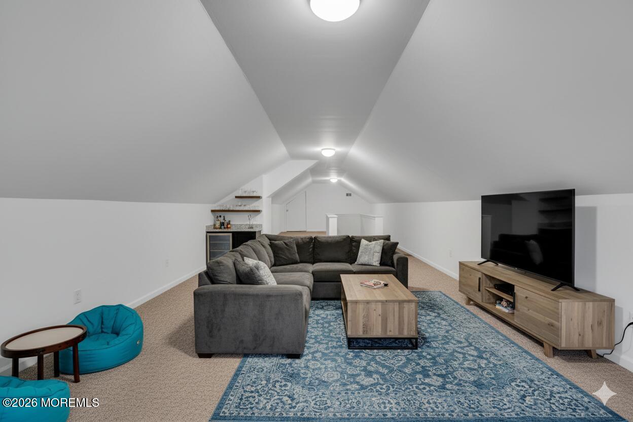 53 Montrose Road Colts Neck, NJ 07722 - Photo 28 of 43 a living room with furniture and a flat screen tv