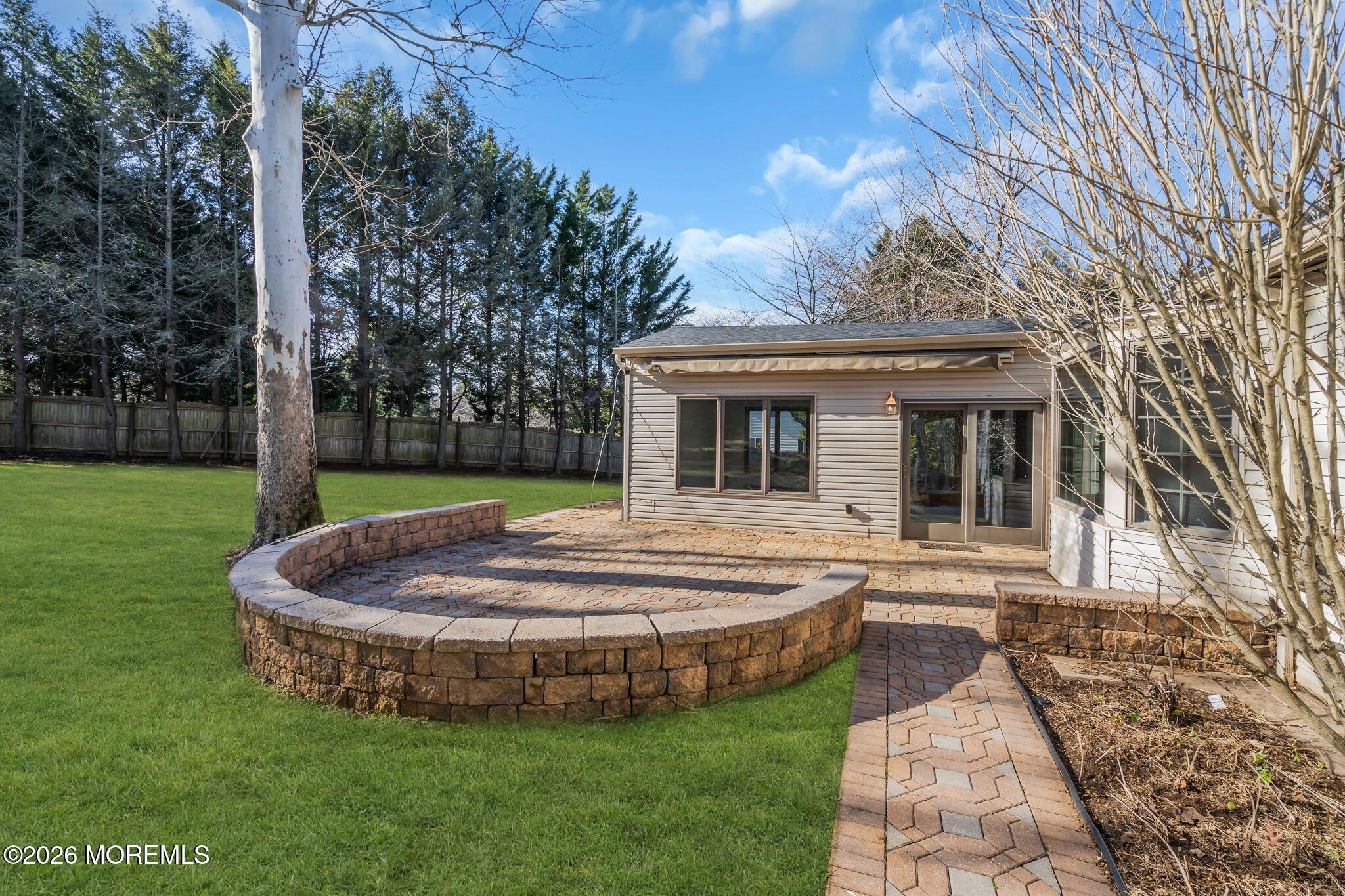 53 Montrose Road Colts Neck, NJ 07722 - Photo 33 of 43 a view of a house with a yard and sitting area