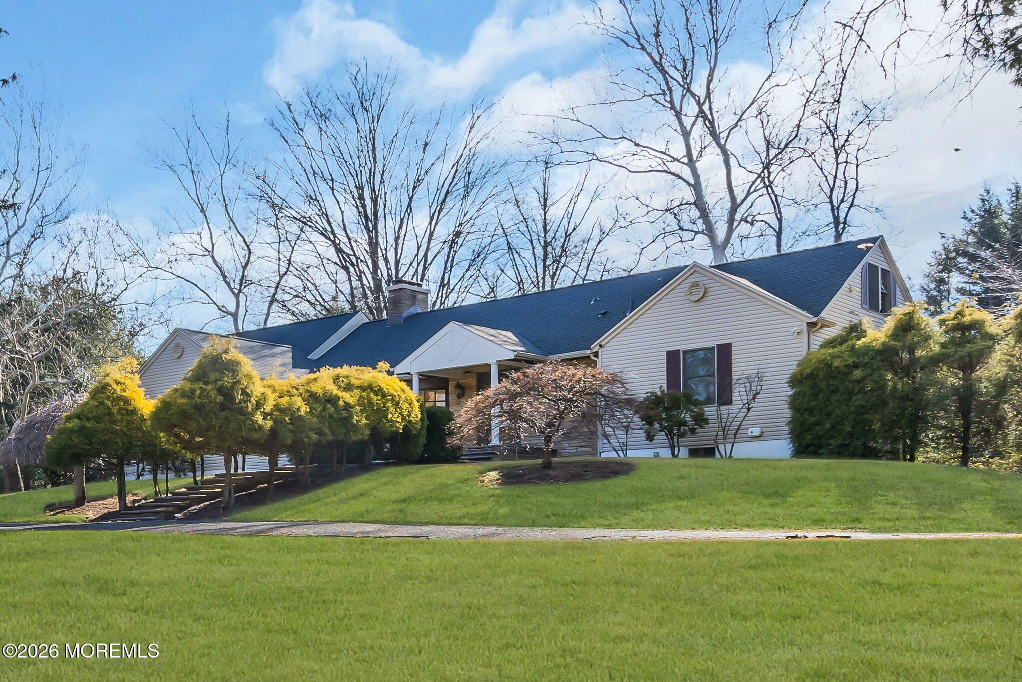 53 Montrose Road Colts Neck, NJ 07722 - Photo 40 of 43 a front view of house with yard and green space