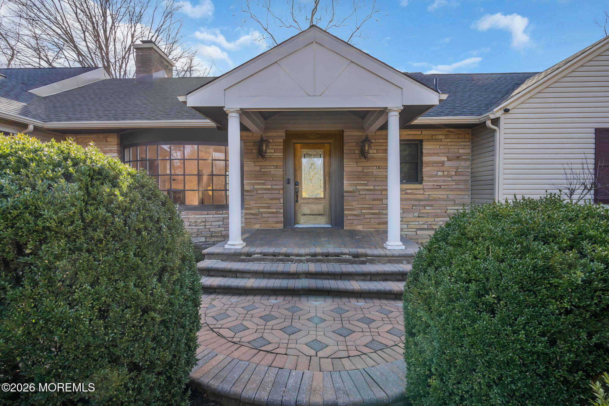 53 Montrose Road Colts Neck, NJ 07722 - Photo 41 of 43 a front view of a house with garden
