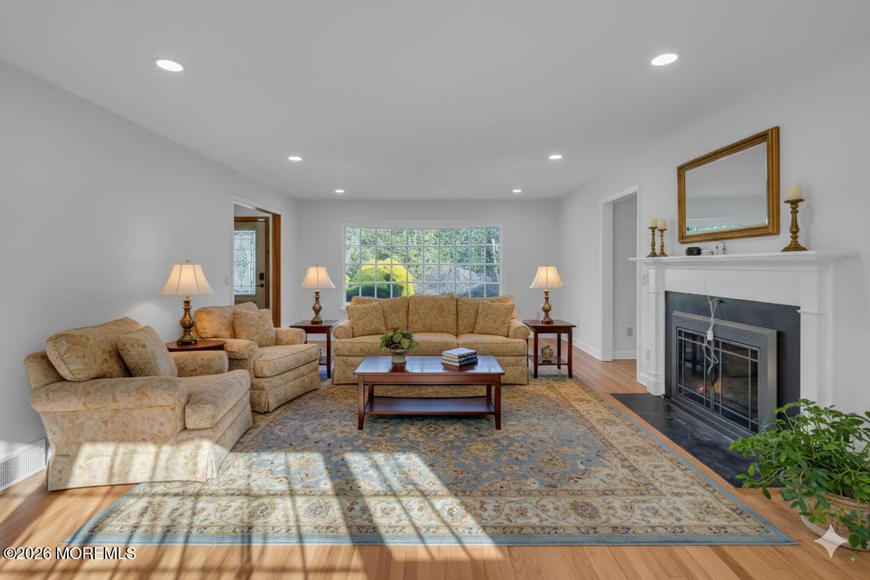 53 Montrose Road Colts Neck, NJ 07722 - Photo 5 of 43 a living room with furniture and a fireplace
