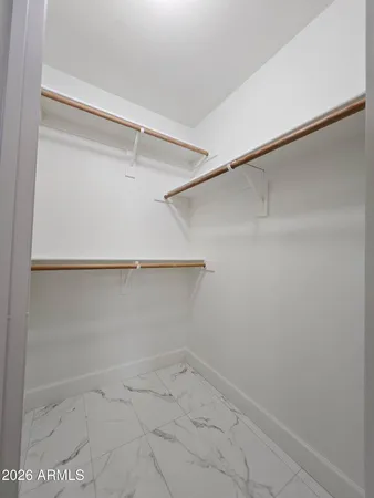 a view of an empty walk in closet