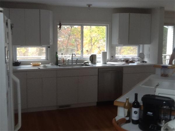 38 Harwood Road Natick, MA 01760 - Photo 5 of 8 a kitchen with granite countertop a sink window and cabinets