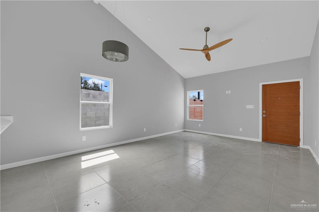 700 Oriole Road, Unit 4 Weslaco, TX 78596 - Photo 3 of 12 an empty room with windows and closet