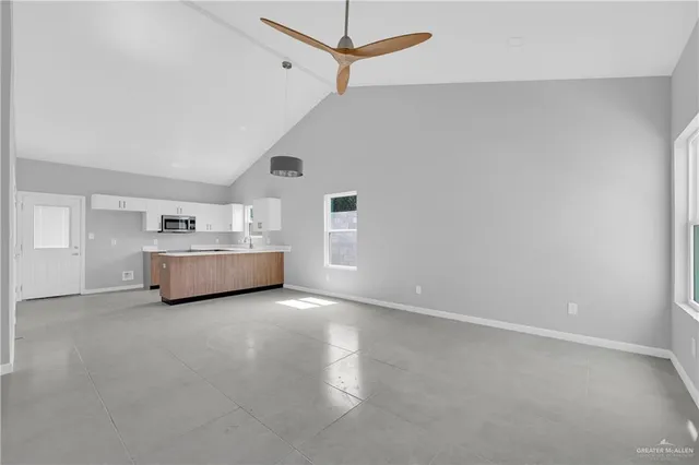 a view of a livingroom with a kitchen