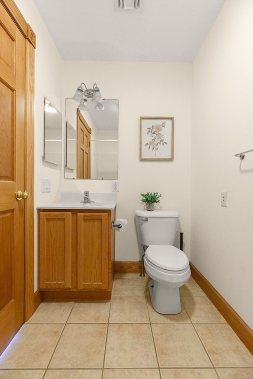 25 Pleasant Street Nahant, MA 01908 - Photo 14 of 39 a bathroom with a toilet sink and mirror