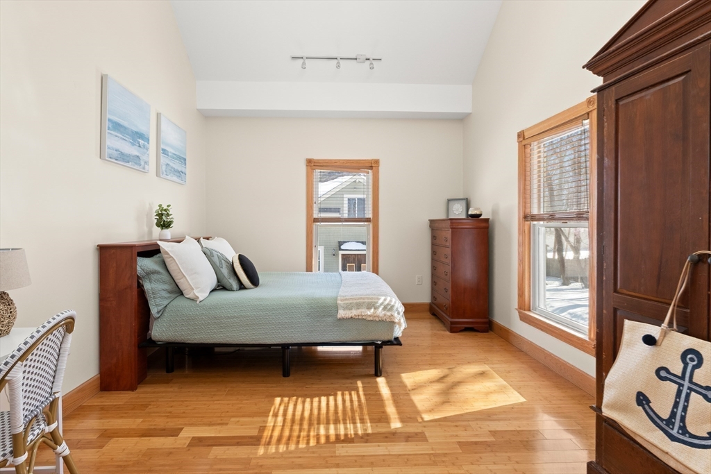 25 Pleasant Street Nahant, MA 01908 - Photo 16 of 39 a bedroom with a bed and wooden floor