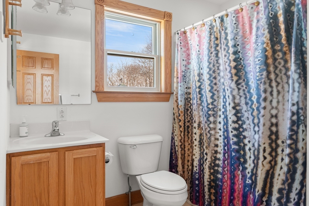 25 Pleasant Street Nahant, MA 01908 - Photo 19 of 39 a bathroom with a toilet a sink and a shower