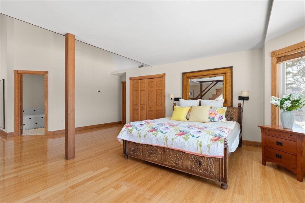 25 Pleasant Street Nahant, MA 01908 - Photo 24 of 39 a bedroom with a bed and wooden floor