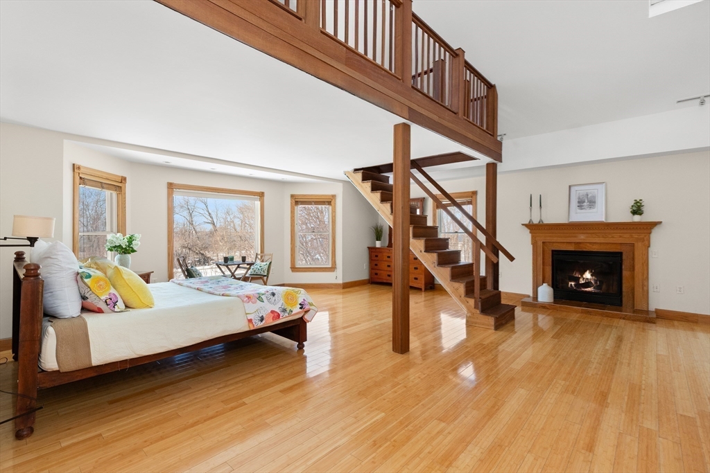 25 Pleasant Street Nahant, MA 01908 - Photo 25 of 39 a bedroom with furniture and a fireplace