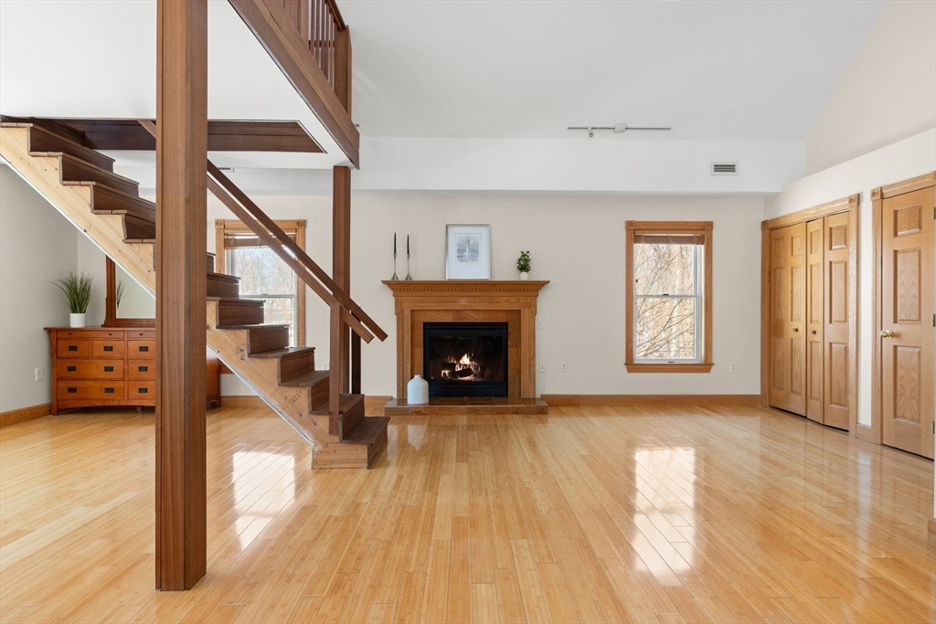 25 Pleasant Street Nahant, MA 01908 - Photo 27 of 39 a view of a livingroom with wooden floor staircase and a kitchen