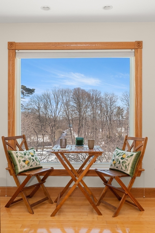 25 Pleasant Street Nahant, MA 01908 - Photo 29 of 39 a living room with a floor to ceiling window and a table