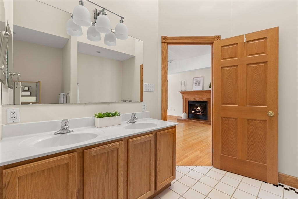 25 Pleasant Street Nahant, MA 01908 - Photo 30 of 39 a bathroom with a sink a vanity and a mirror