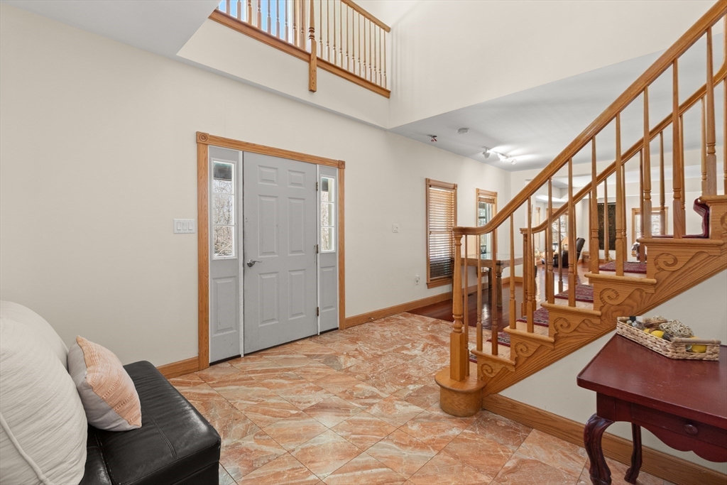 25 Pleasant Street Nahant, MA 01908 - Photo 6 of 39 a view of a livingroom with furniture and stairs