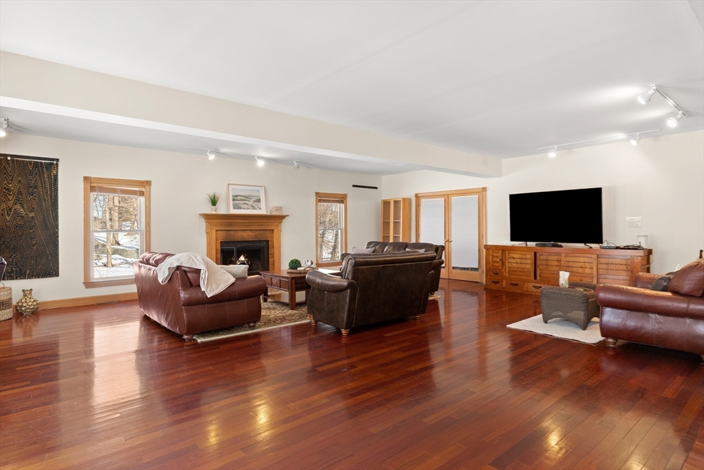 25 Pleasant Street Nahant, MA 01908 - Photo 8 of 39 a living room with furniture fireplace and flat screen tv