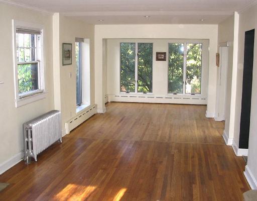 205 Gladstone Road Pittsburgh, PA 15217 - Photo 2 of 15 Dining Room. View from living area through into skylit dining area. You may not find another house of this vintage with this much light! View is of the backyard apple tree in the fenced backyard. A sliding door to the right opens onto a charming patio.