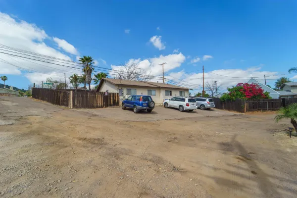 an aerial view of a house with outdoor space