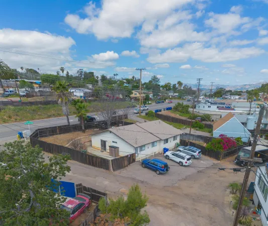 an aerial view of a balcony with chairs