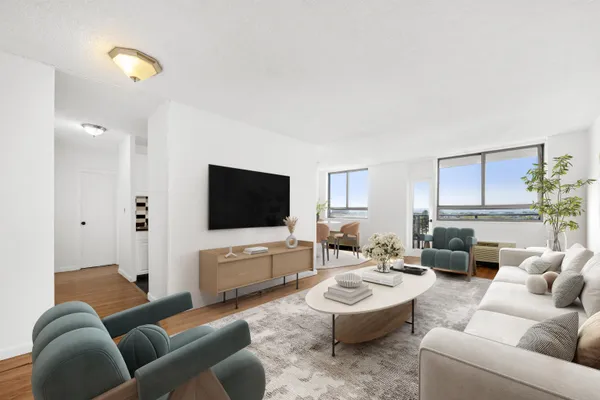 a living room with furniture and a flat screen tv