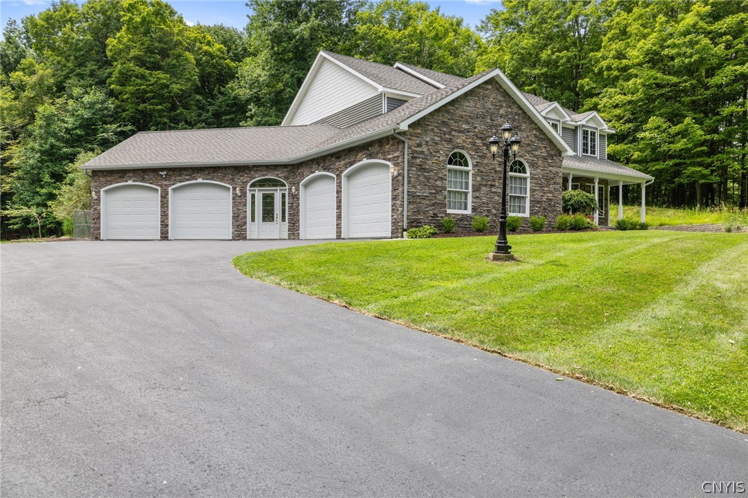 1103 Rail Fence Road Camillus, NY 13031 - Photo 4 of 50 If you've been searching for a home with exceptional garage space, this one delivers! The oversized four-car garage is perfect for storing recreational vehicles, boats, ATVs, lawn equipment, or creating the ultimate workshop. With plenty of room for vehicles, hobbies, and storage, it's a rare feature that offers both versatility and convenience.