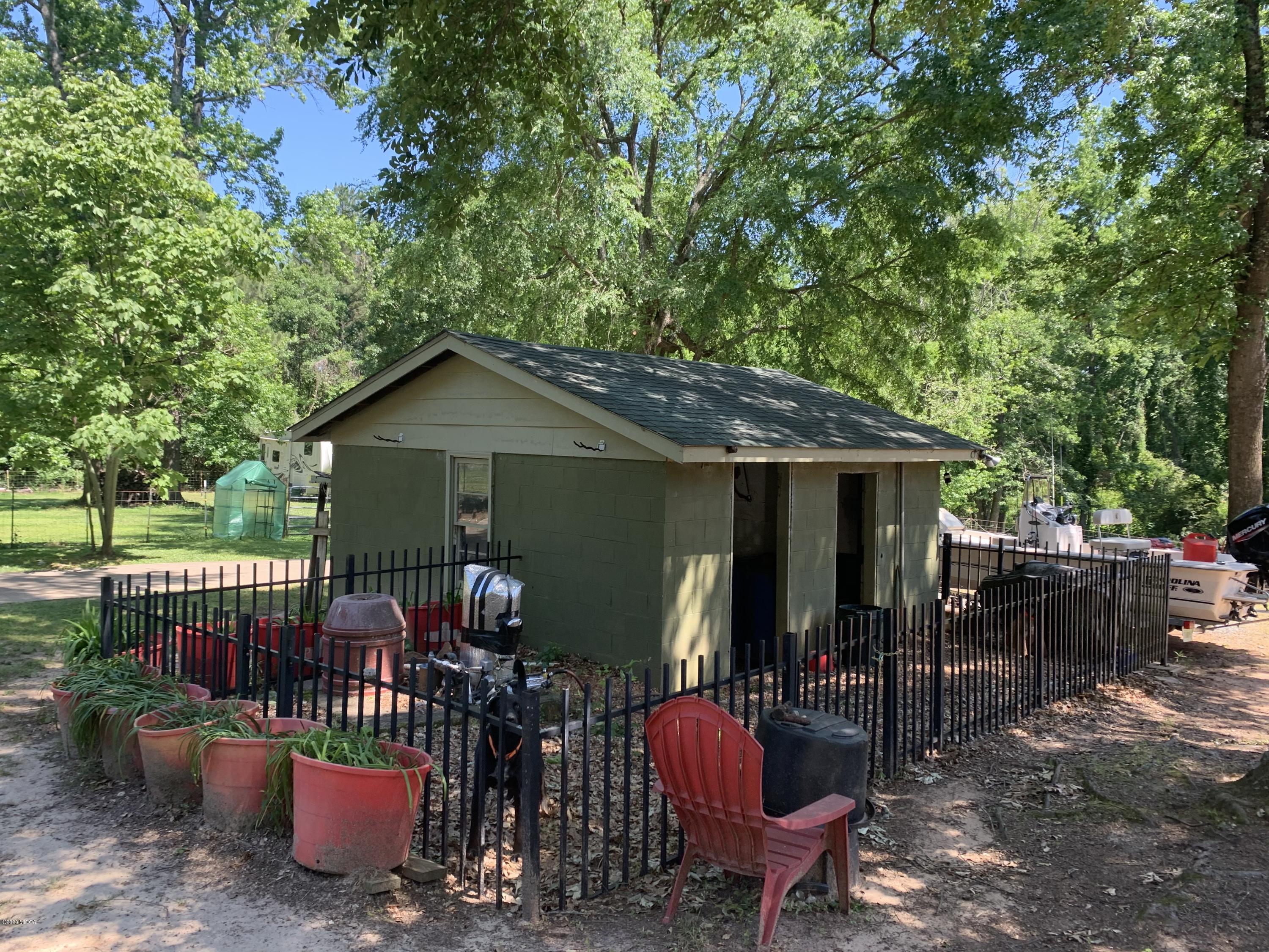 7316 Colaparchee Road Macon, GA 31220 - Photo 11 of 13 a view of a chair and table in backyard