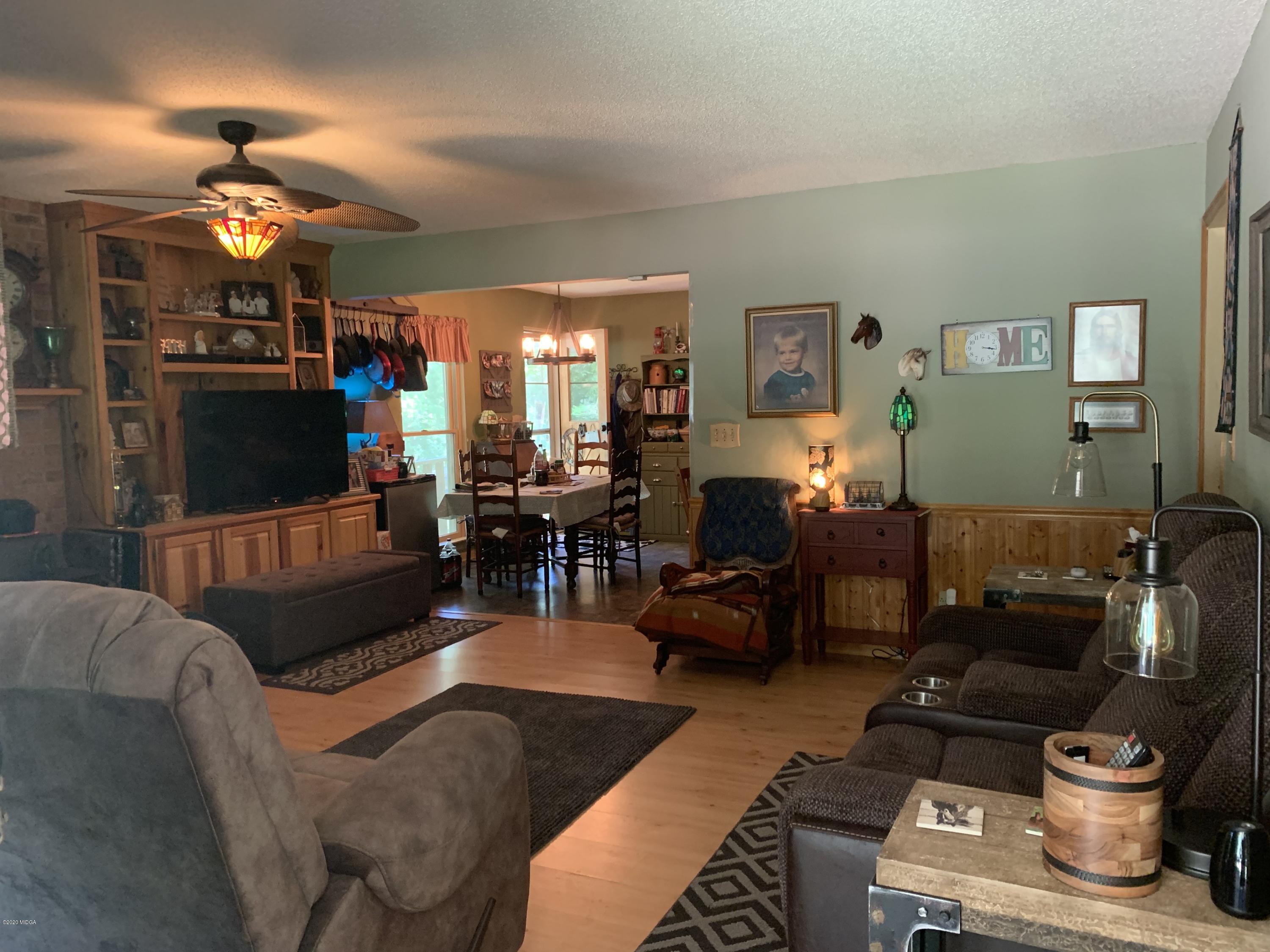 7316 Colaparchee Road Macon, GA 31220 - Photo 6 of 13 a living room with furniture and a chandelier