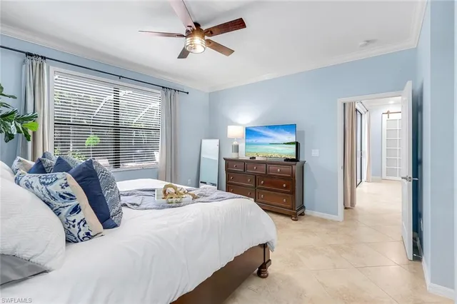 a bedroom with a bed and dresser with mirror