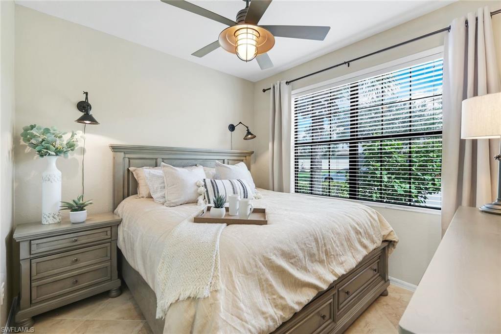 3783 Treasure Cove Circle Naples, FL 34114 - Photo 23 of 43 a bedroom with a bed and a window