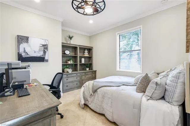 a bedroom with a bed furniture and a window