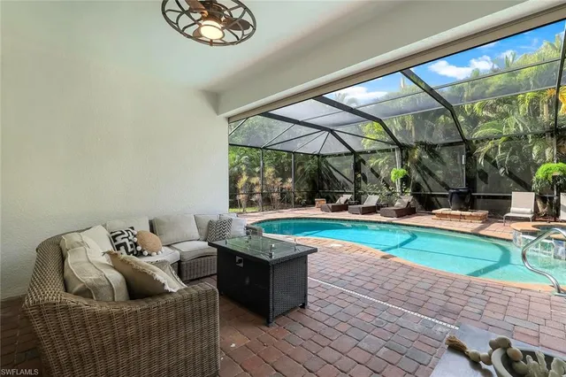a living room with couch and a large window