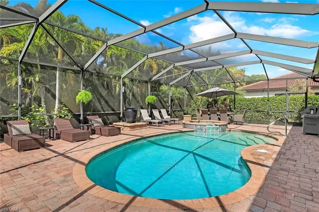 a view of a swimming pool with a patio