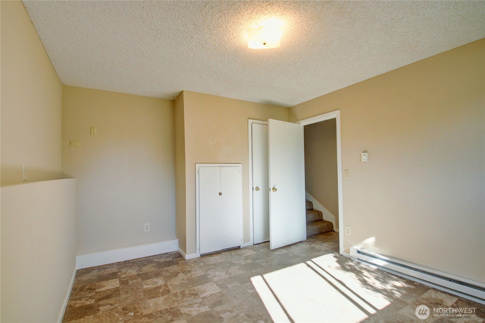 1214 36th Street Anacortes, WA 98221 - Photo 20 of 35 a view of an empty room and window