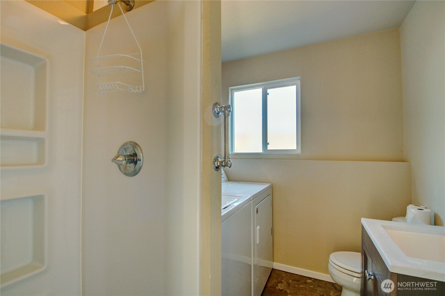 1214 36th Street Anacortes, WA 98221 - Photo 23 of 35 a bathroom with a sink toilet and mirror