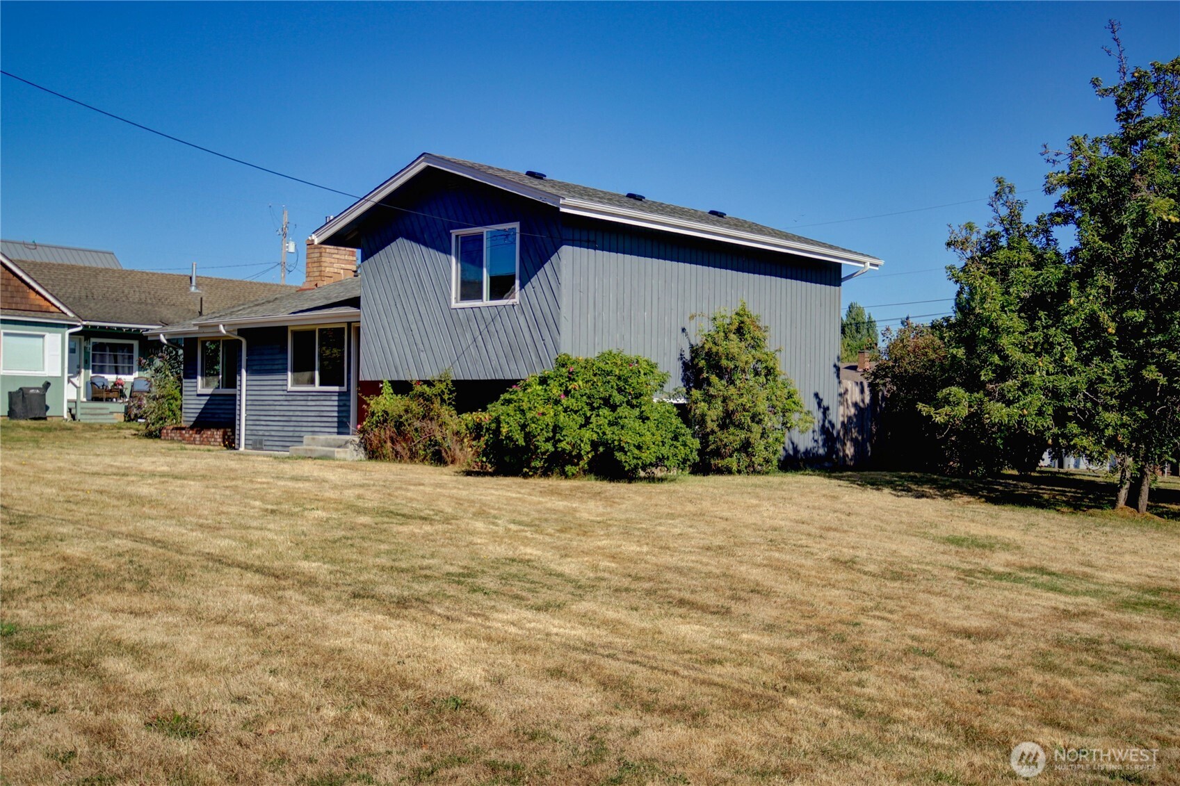 1214 36th Street Anacortes, WA 98221 - Photo 3 of 35 a front view of a house with a yard