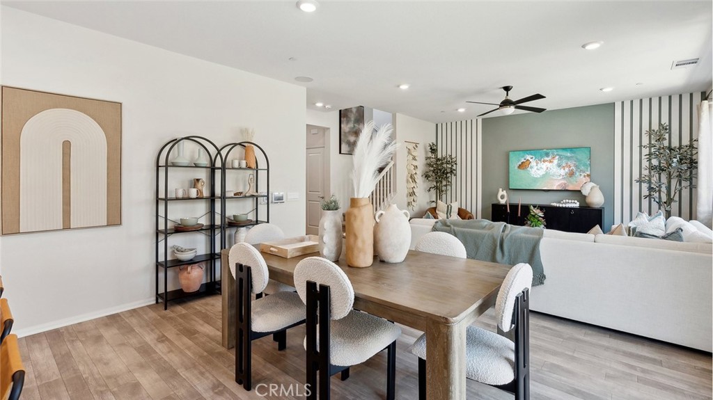 11392 Forge Road Corona, CA 92883 - Photo 10 of 24 a view of a dining room with furniture window and wooden floor