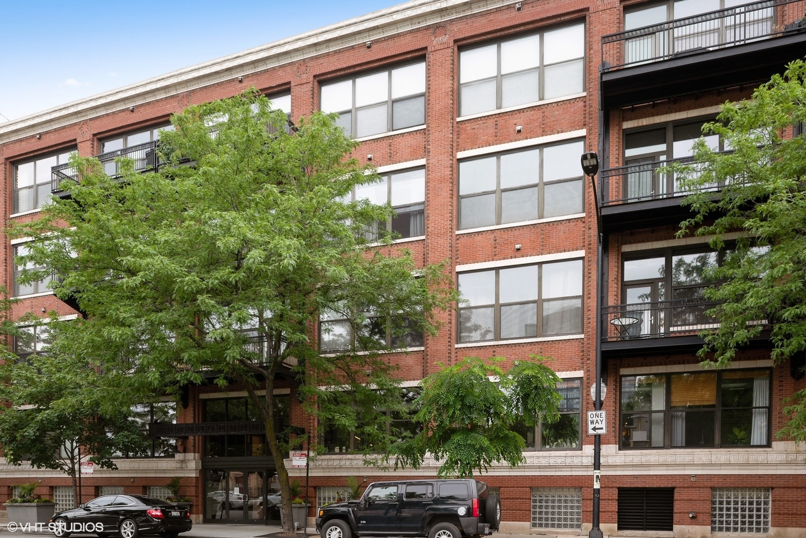 1040 West Adams Street, Unit 428 Chicago, IL 60607 - Photo 1 of 28 a car parked in front of a building