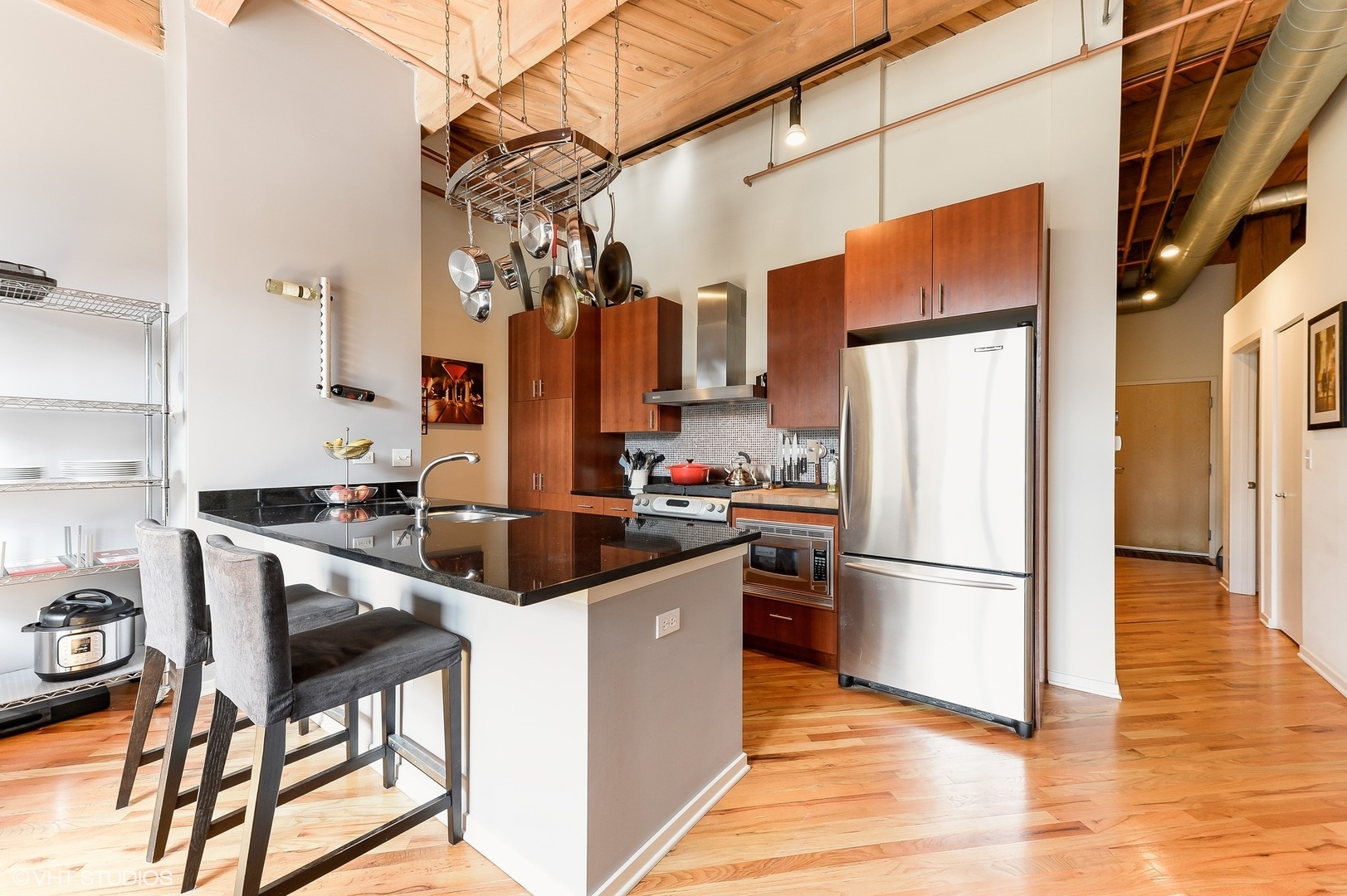 1040 West Adams Street, Unit 428 Chicago, IL 60607 - Photo 12 of 28 a kitchen with stainless steel appliances a refrigerator a stove a sink and a refrigerator